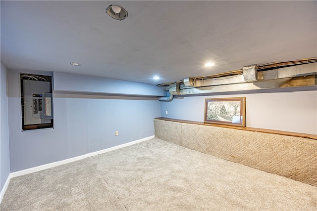 basement with carpet and electric panel