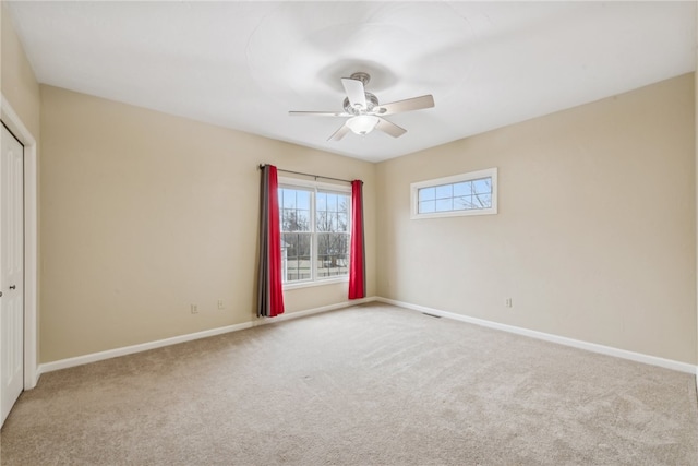 empty room with carpet floors and ceiling fan