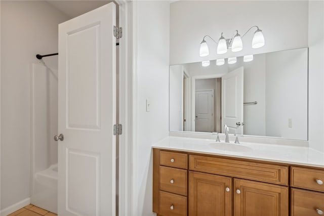 bathroom featuring tile patterned floors, vanity, and bathing tub / shower combination