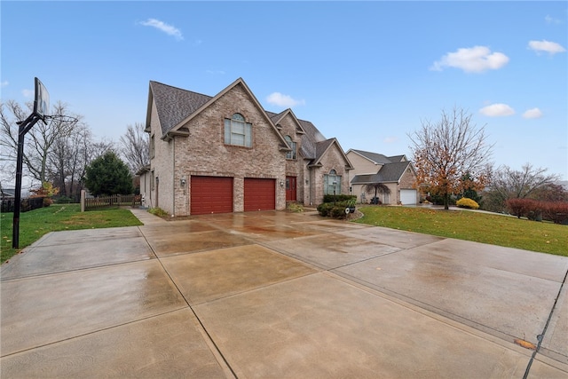 view of front of house with a front lawn and a garage