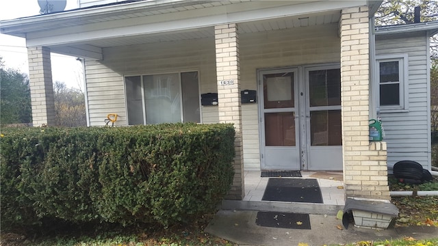 entrance to property with covered porch