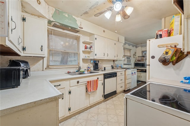 kitchen featuring white appliances, white cabinetry, ceiling fan, and sink