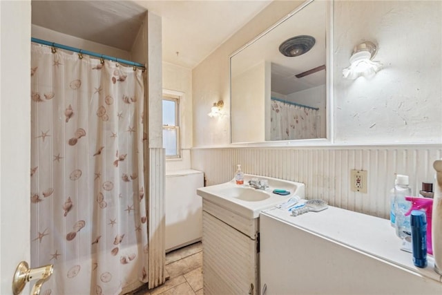 357 E Mcmurray Rd, Peters Twp, PA 15317 - full bathroom featuring vanity, wainscoting, tile patterned floors, and a shower with shower curtain