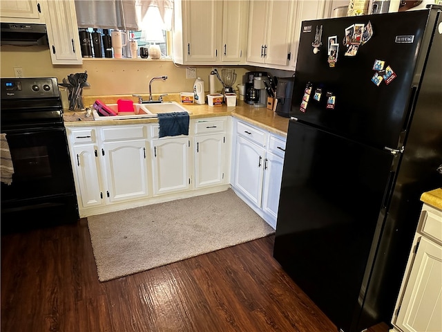 kitchen featuring extractor fan, dark wood-type flooring, sink, black appliances, and white cabinets