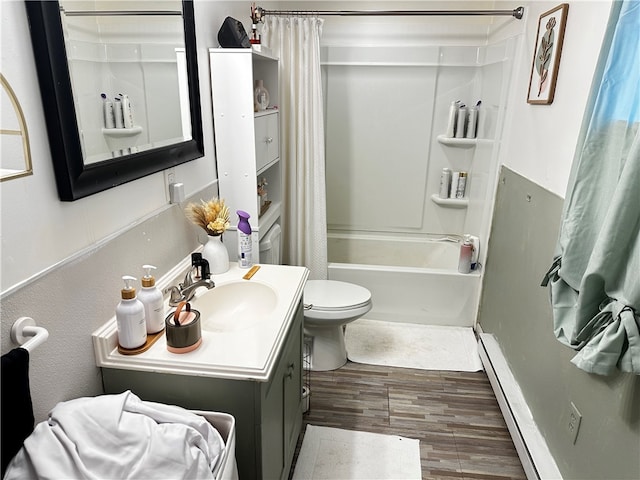 full bathroom with shower / bath combo, baseboard heating, wood-type flooring, toilet, and vanity