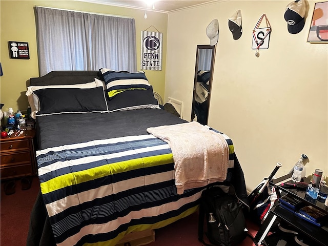 bedroom featuring ornamental molding and carpet floors