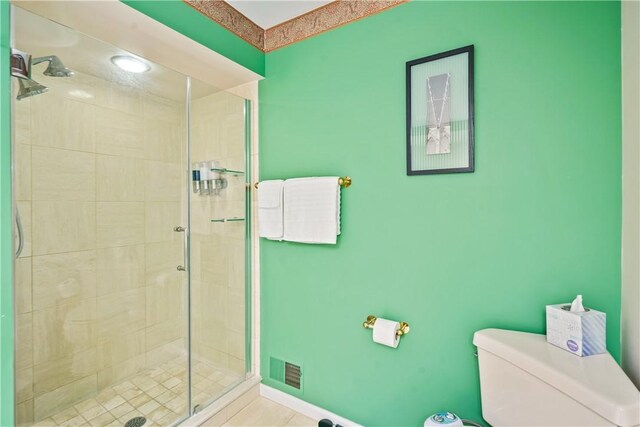 bathroom with toilet and walk in shower