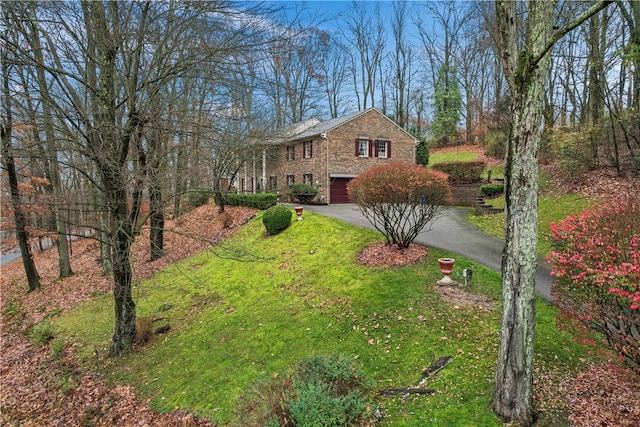 view of yard featuring a garage