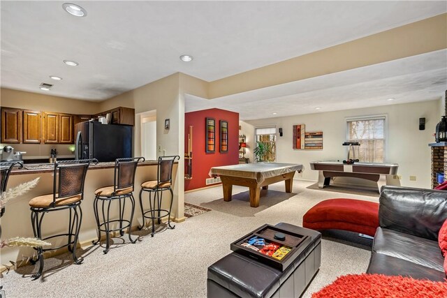 recreation room with light colored carpet and pool table