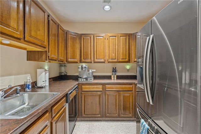 kitchen with dishwasher, stainless steel fridge with ice dispenser, and sink