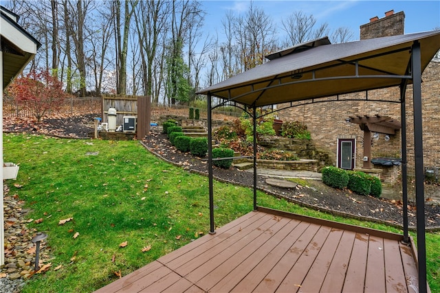 wooden terrace with a yard