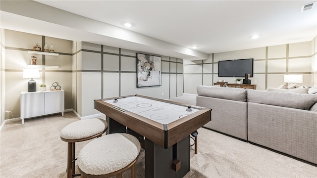 recreation room featuring light colored carpet