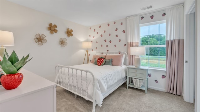 bedroom with light carpet