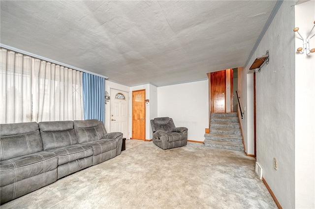 carpeted living room with a textured ceiling