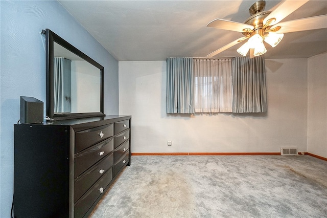 bedroom featuring ceiling fan and light carpet