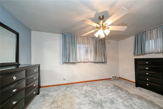 bedroom with light colored carpet and ceiling fan