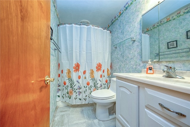 bathroom with vanity, a shower with shower curtain, and toilet