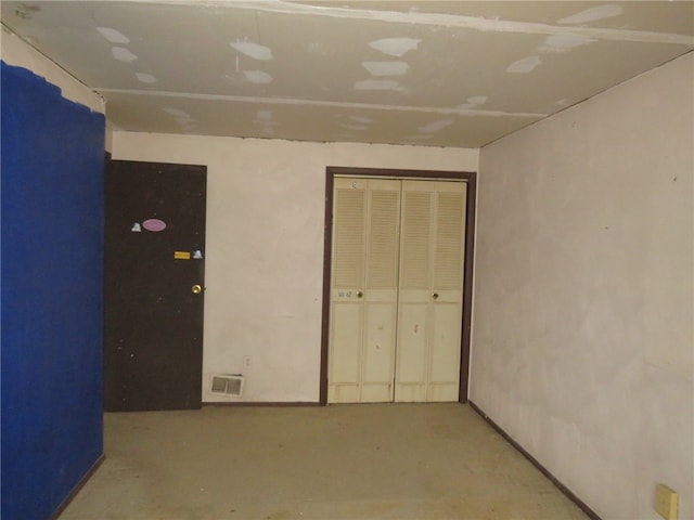 unfurnished bedroom featuring concrete floors