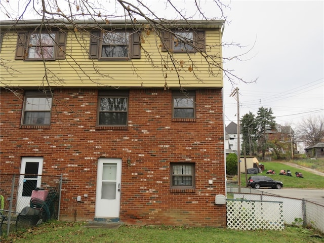 back of house with a yard