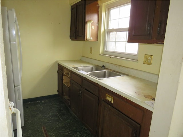 kitchen with white refrigerator and sink