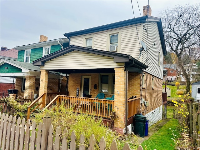 view of front of property featuring covered porch and cooling unit