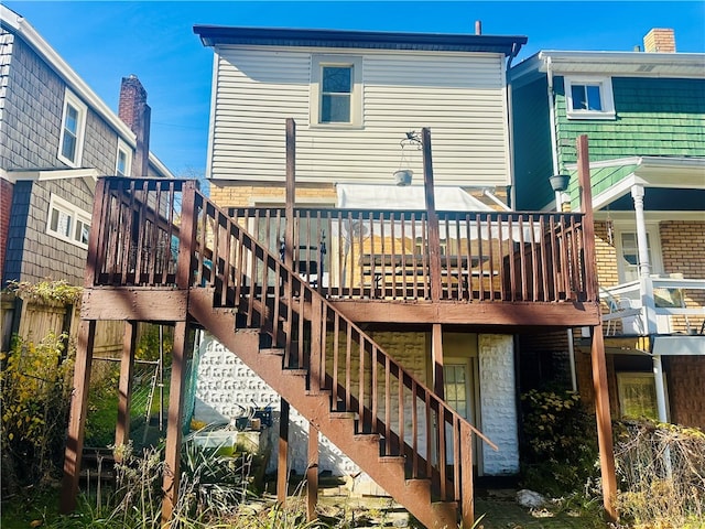 rear view of property with a deck