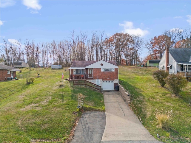 view of front facade with a front yard and a garage