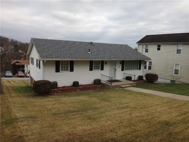 view of front of property with a front lawn