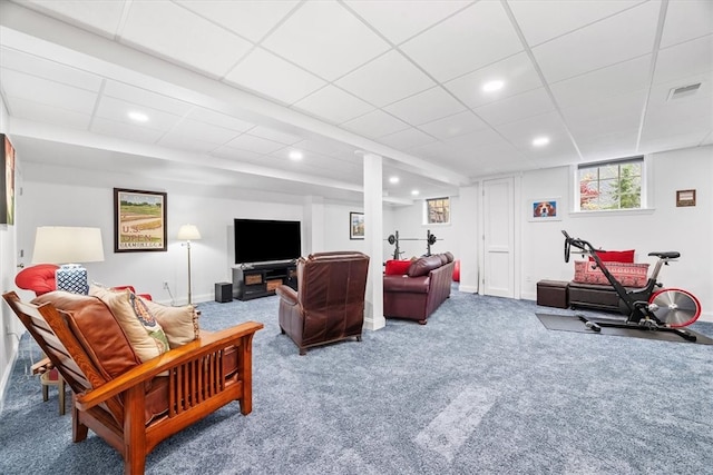 living room with carpet flooring and a drop ceiling