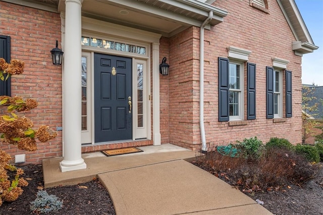 view of exterior entry with covered porch