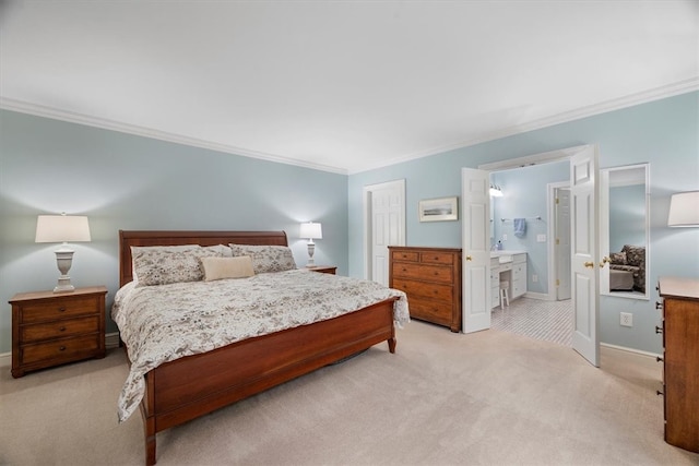 carpeted bedroom with ensuite bath and ornamental molding