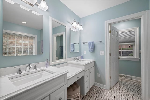 bathroom featuring tile patterned flooring and vanity