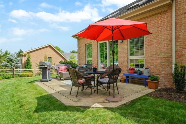 view of patio featuring a grill