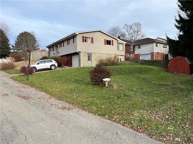 view of home's exterior featuring a lawn and a garage