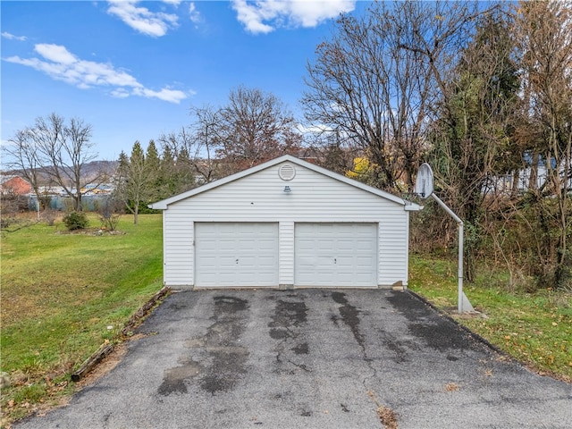 garage with a lawn