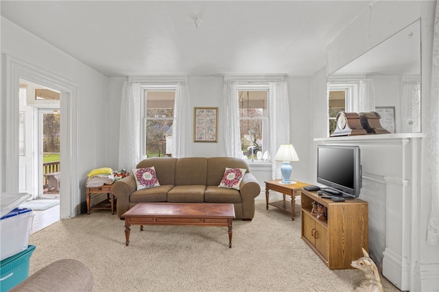 carpeted living room featuring a healthy amount of sunlight