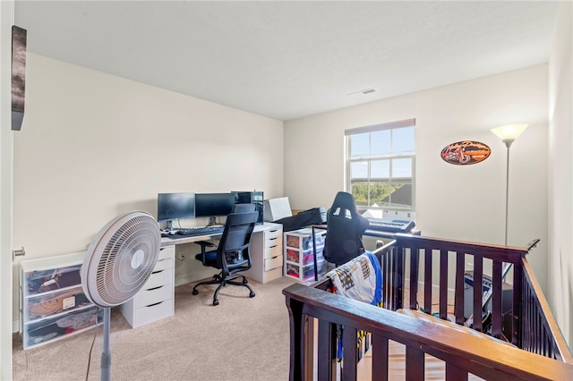 bedroom featuring light carpet