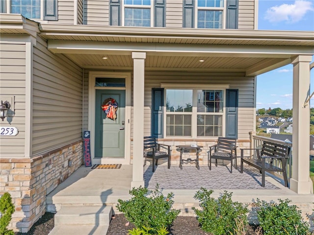 doorway to property featuring covered porch