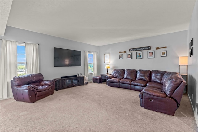 carpeted living room featuring a wealth of natural light