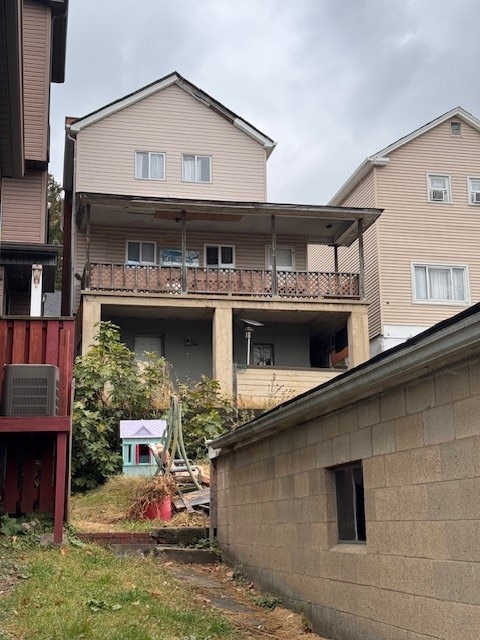 rear view of property with a balcony