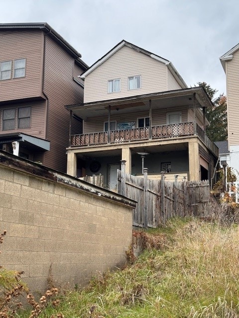 rear view of property with a balcony