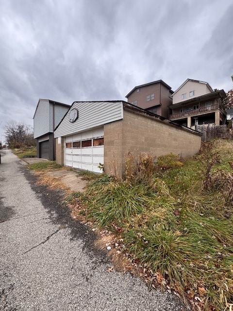 view of property exterior featuring a garage