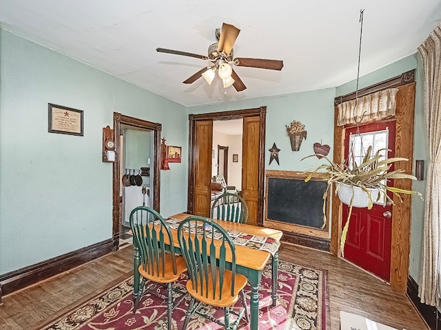 dining space featuring dark hardwood / wood-style floors and ceiling fan