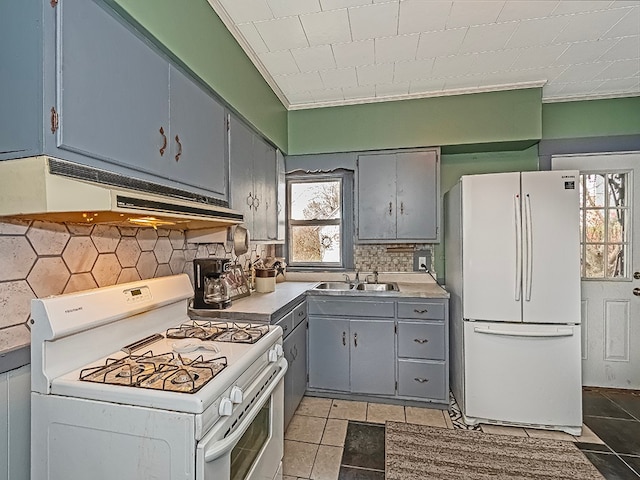 kitchen featuring light tile patterned floors, white appliances, sink, and extractor fan