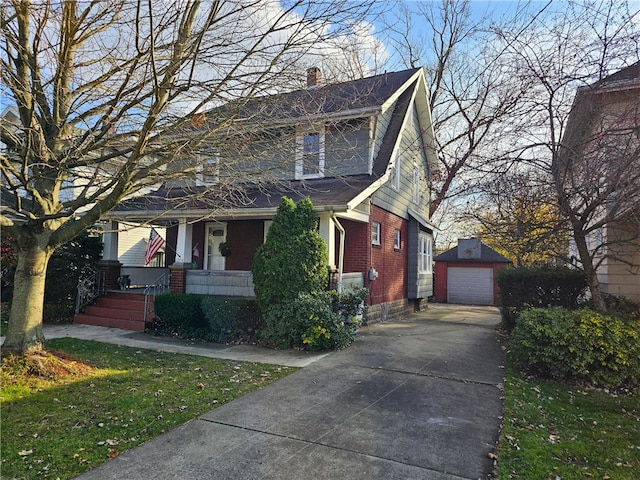 view of front of property featuring a garage and an outdoor structure