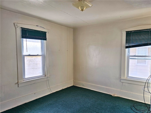 unfurnished room with carpet floors