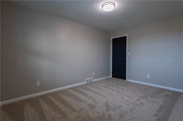 unfurnished room with carpet floors