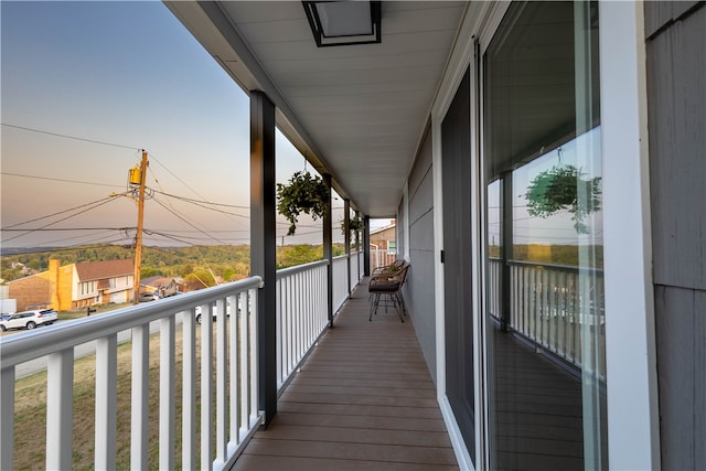 view of balcony at dusk