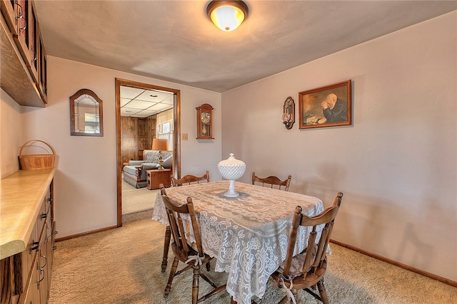 dining room featuring light colored carpet