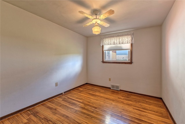 spare room with ceiling fan and light hardwood / wood-style flooring